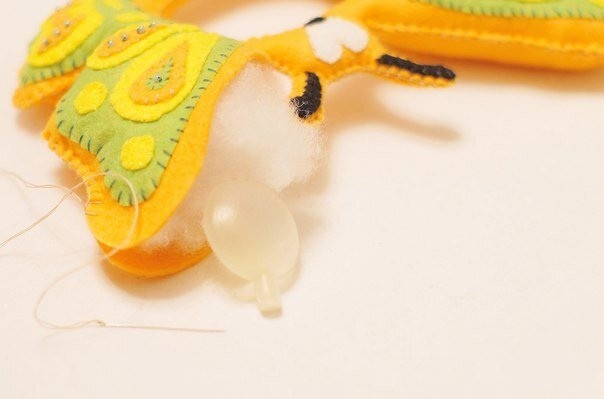 Игрушка на фотоаппарат