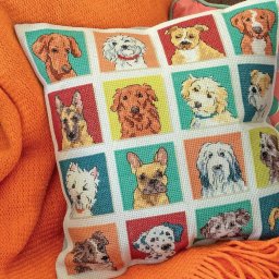 Подушка с вышитыми мордочками собак