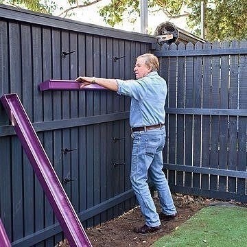 Вертикальный цветник из водосточных труб